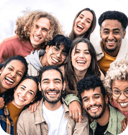 A diverse group of people smiling together